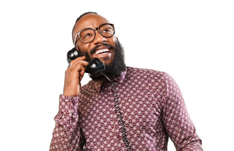 happy black man talking on telephone